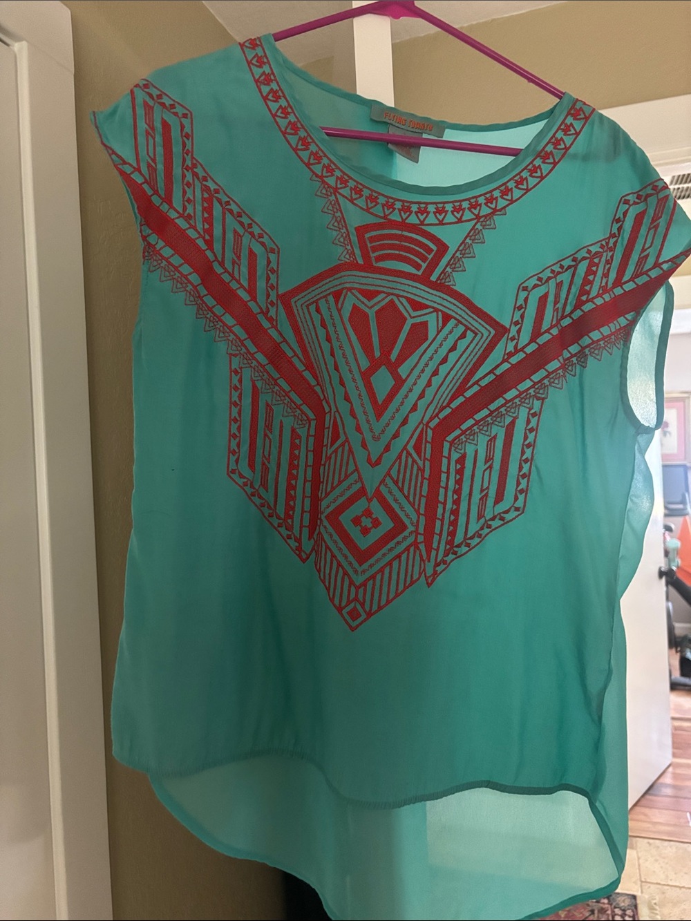 Flying Tomato Turquoise Sleeveless Blouse with Red Graphic Print
